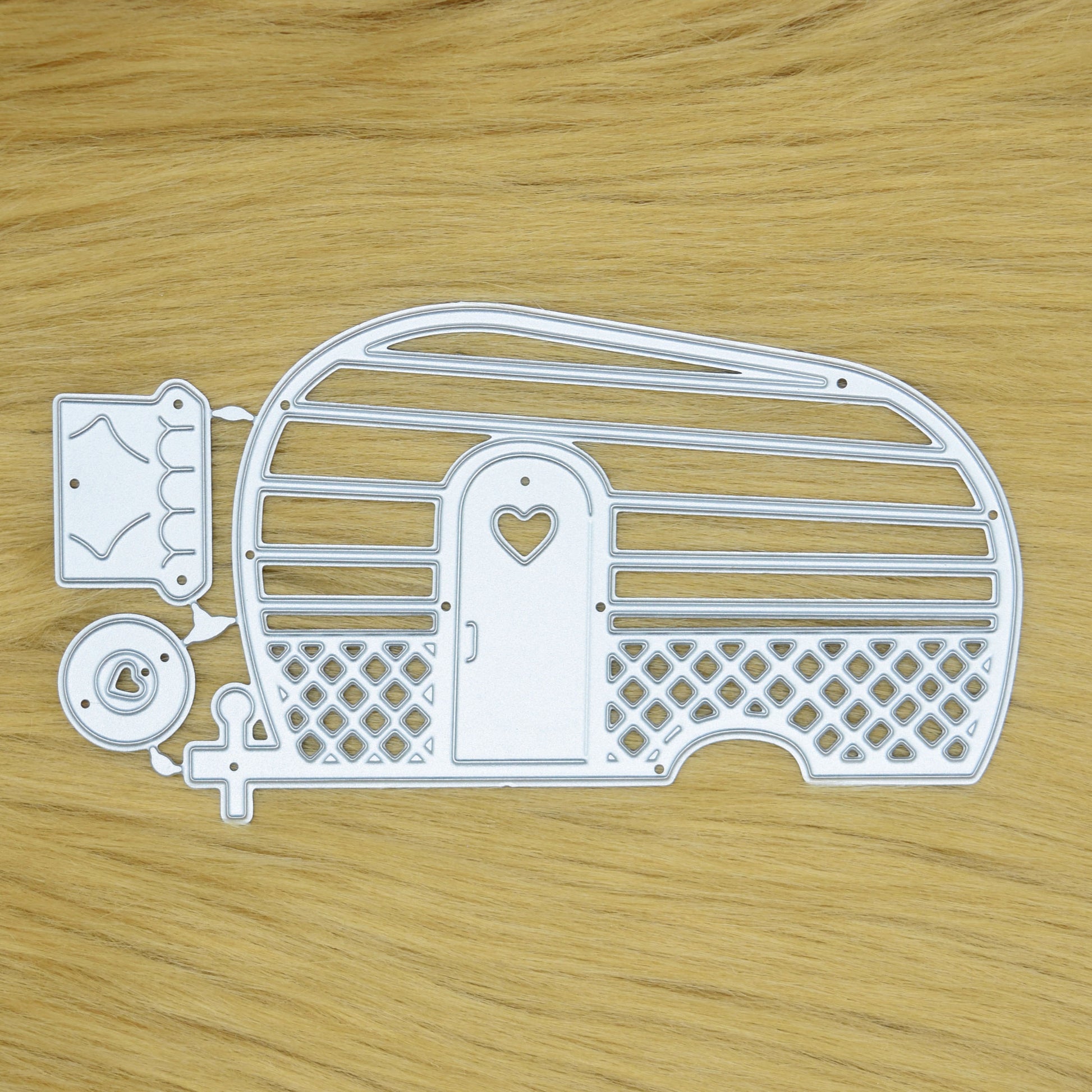 Retro caravan metal cutting die set displayed on a faux fur background for card making