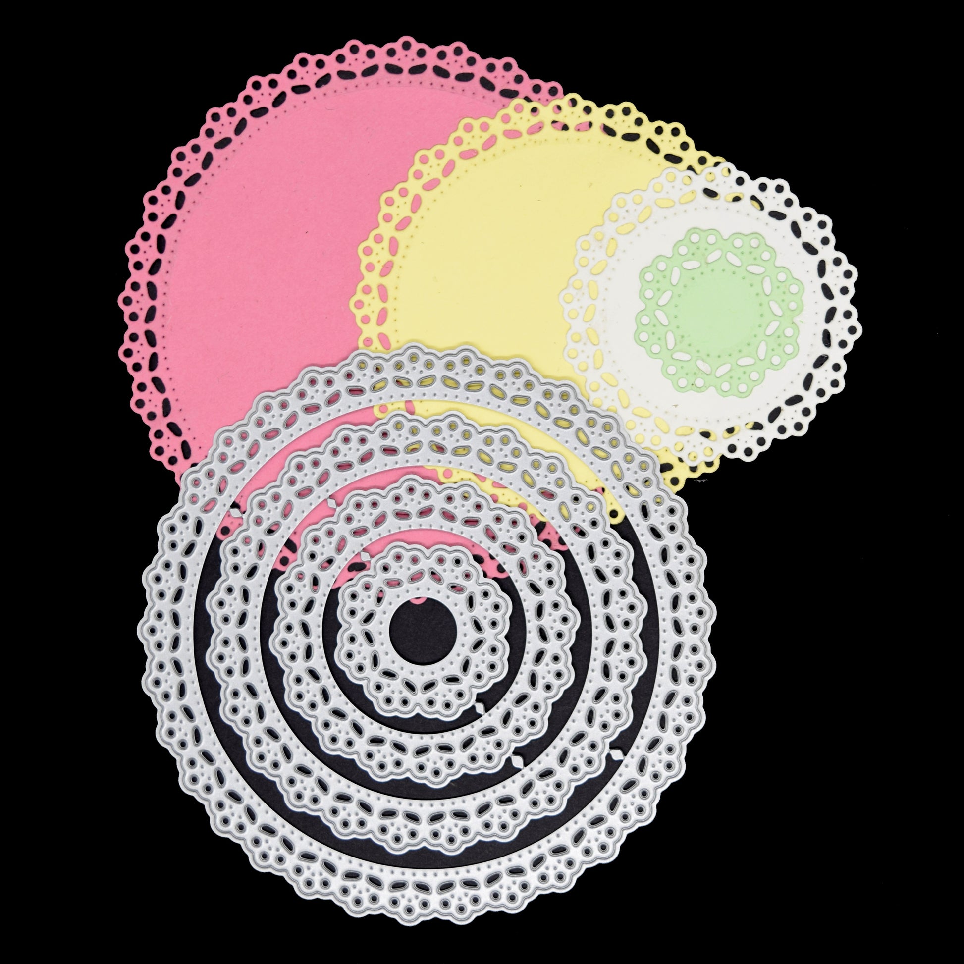 Round lace nesting dies with finished layered paper cut examples in different sizes