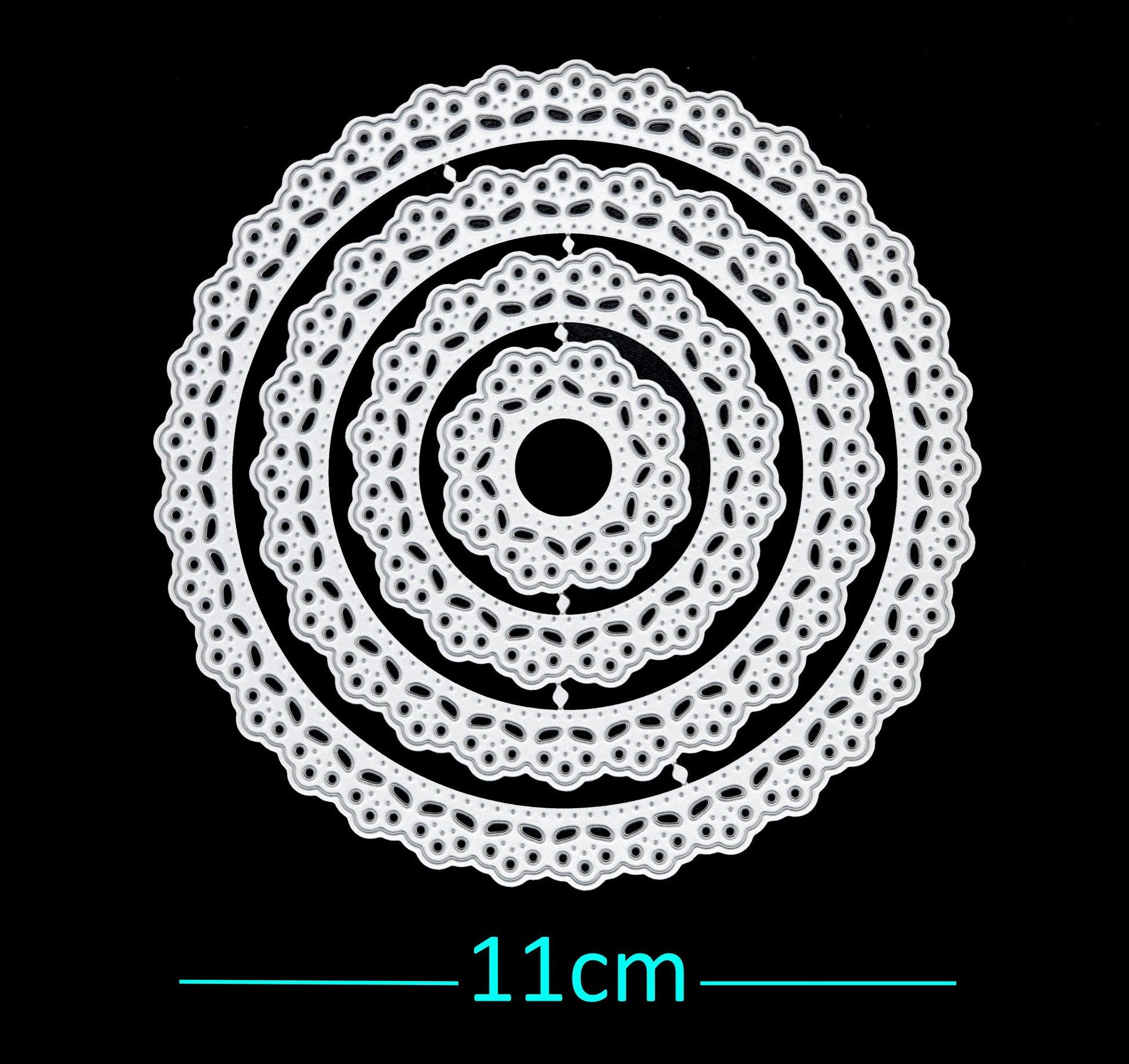 Round lace patterned nesting metal cutting dies set on black background