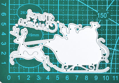 Santa sleigh, reindeer and sentiment metal cutting dies on a centimetre cutting mat, showing the overall set size.