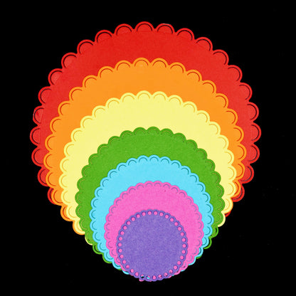 Layered scalloped circle paper die cuts made with metal cutting dies for card making