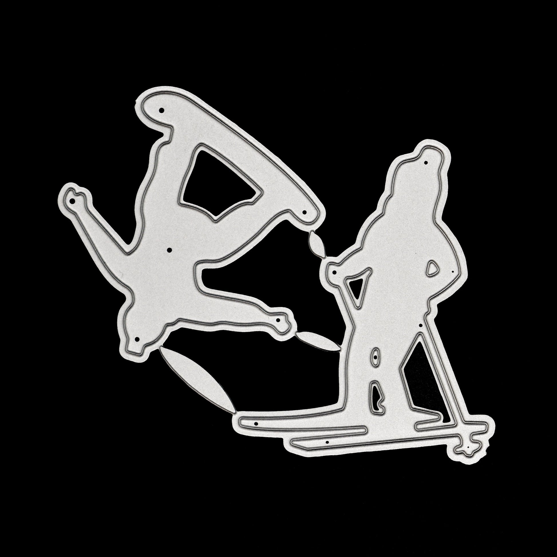 Skier and snowboarder metal cutting dies shown on a black background, featuring downhill skiing and snowboarding silhouettes.