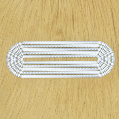 Stitched slimline oval metal cutting dies set arranged together showing elongated nesting shapes