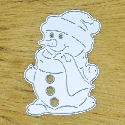 Snowman metal cutting die on a tan faux fur background, showing the cutting face and fine details for festive papercraft.