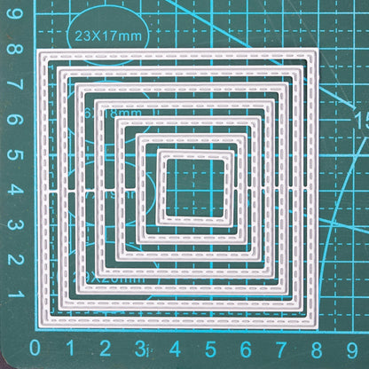 Square stitched nesting dies on measuring mat showing size