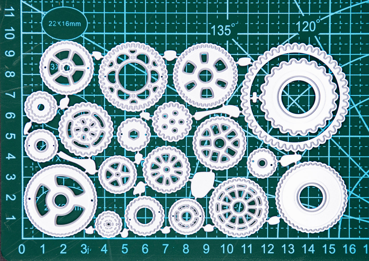 Steampunk cogs metal cutting dies set displayed on a cutting mat for size reference