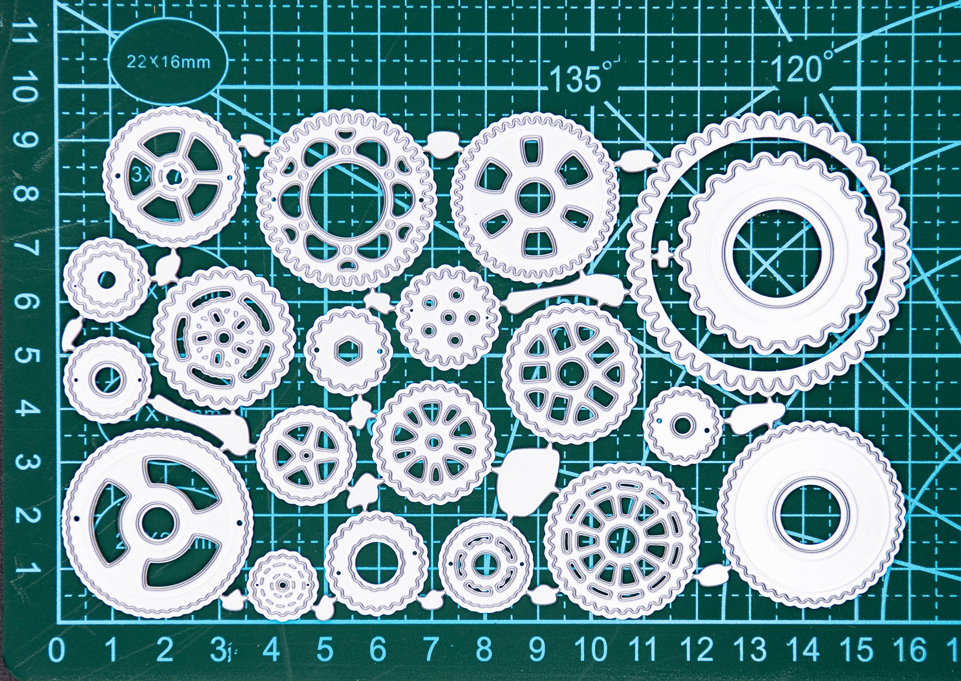 Steampunk cogs metal cutting dies set displayed on a cutting mat for size reference