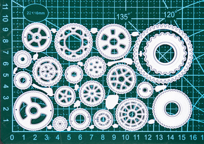 Steampunk cogs metal cutting dies set displayed on a cutting mat for size reference