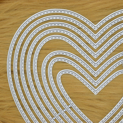 Close up of stitched heart metal cutting dies for papercraft and card making