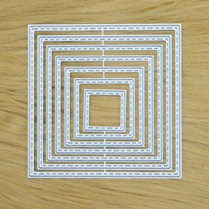 Stitched square metal cutting dies set on faux fur background