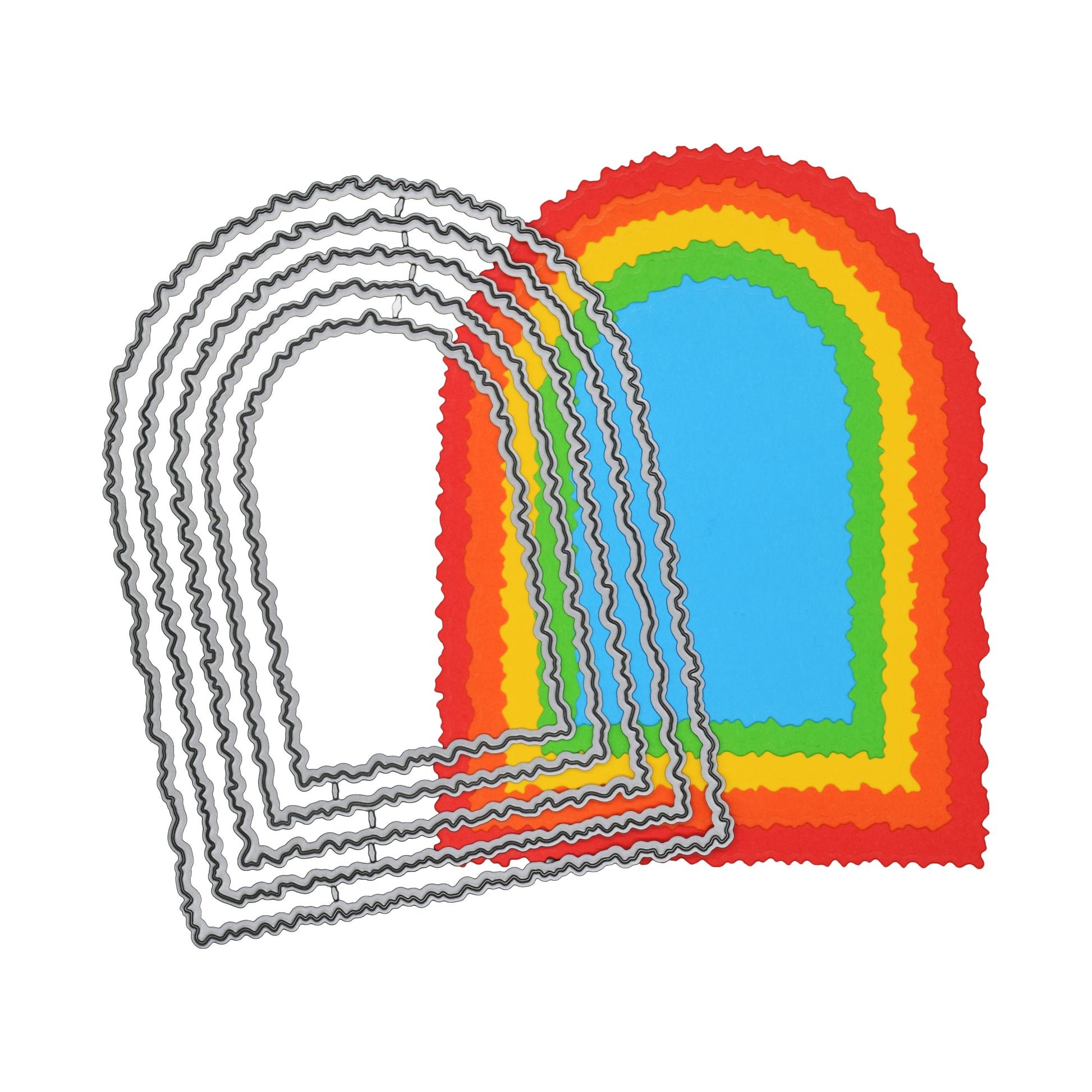 Torn edge arch nesting metal cutting dies layered over colourful example cuts on a grey background for card making inspiration.