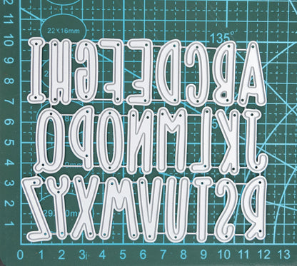 Uppercase alphabet metal cutting dies set shown on measuring mat for size reference