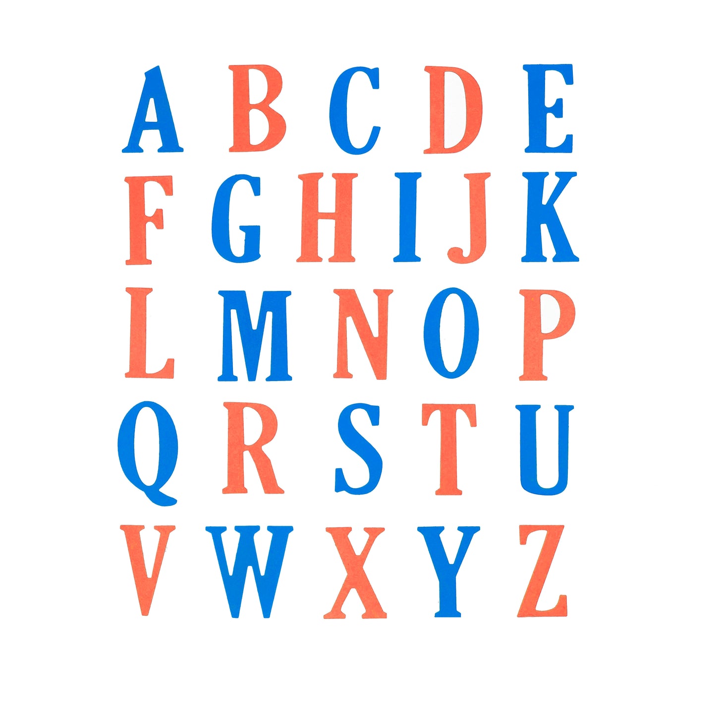 Complete uppercase alphabet cut from blue and coral paper using large letter metal cutting dies for card making and displays.