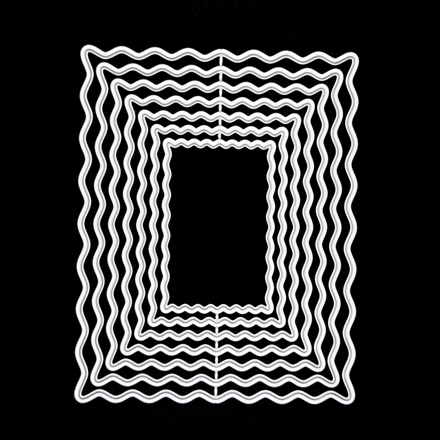 Wavy rectangle nesting metal cutting dies on black background