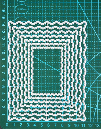 Wavy rectangle nesting dies on cutting mat showing size