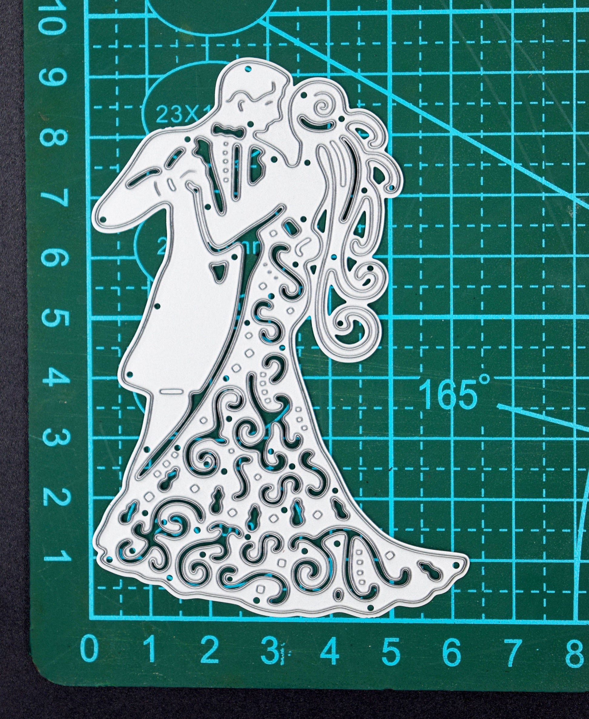 Bride and groom metal cutting die on cutting mat showing size