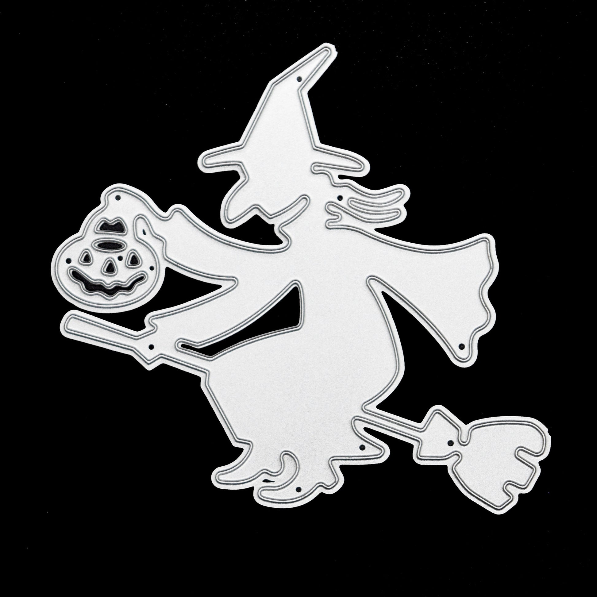 Witch on broomstick metal cutting die on black background