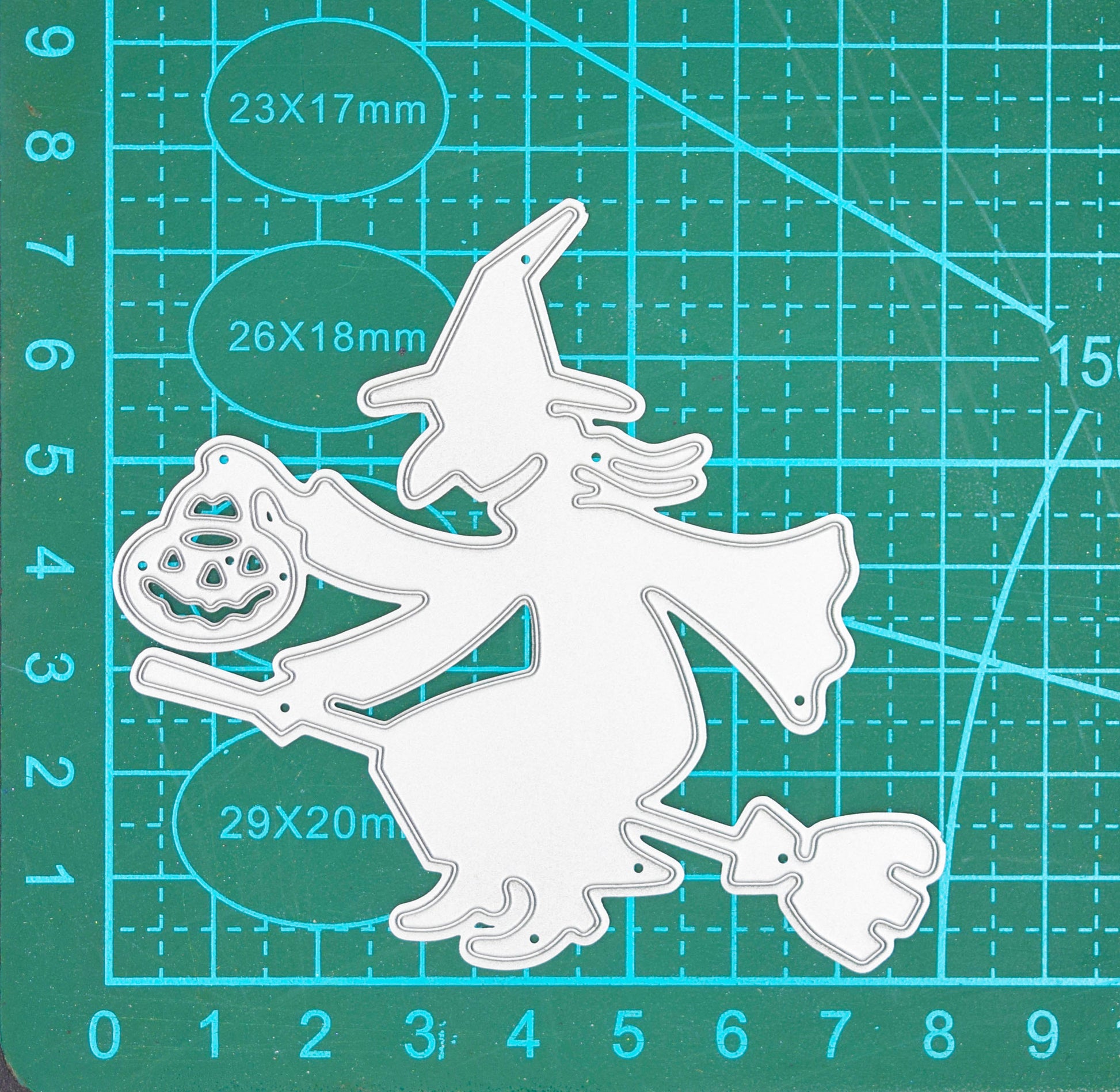 Witch on broomstick metal cutting die on cutting mat showing size